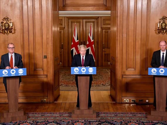 File photo dated 19/12/2020 of Chief scientific adviser Sir Patrick Vallance (left) and Chief Medical Officer Professor Chris Whitty (right), listen to Prime Minister Boris Johnson (PA)