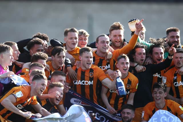 Hull City players celebrate promotion to the Championship, one of four promotions under Assem Allam (Picture: PA)