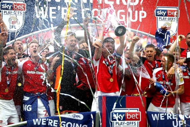 Rotherham United's Richard Wood celebrates with the trophy and team-mates after the Sky Bet League One Final at Wembley in 2018. Picture: PA