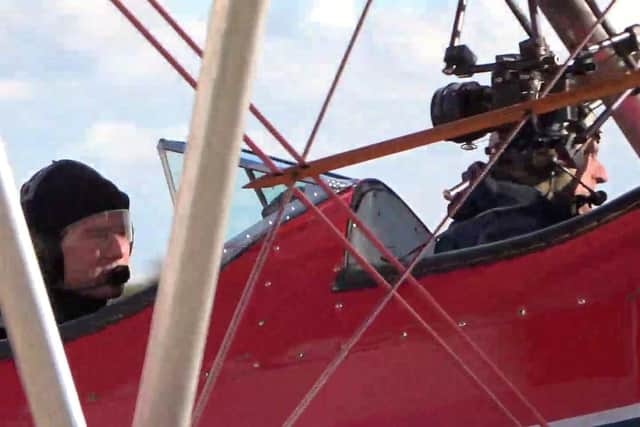 The Top Gun actor can be seen learning to fly a 1943 Boeing-Stearman Model 75 with the help of ex-German Air Force pilot Klaus Plasa.