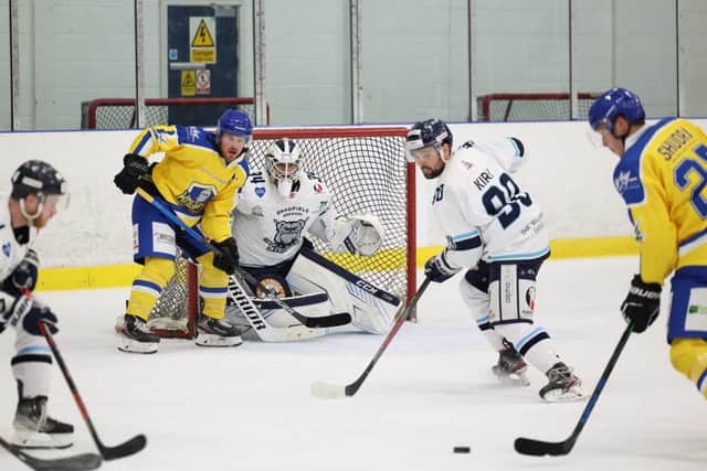 Cole Shudra, far right, gets a shot in on Sheffield Steeldogs' netminder Dmitri Zimozdra, while Leeds team-mate Matty Davies tries to distract. Picture courtesy of Peter Best.