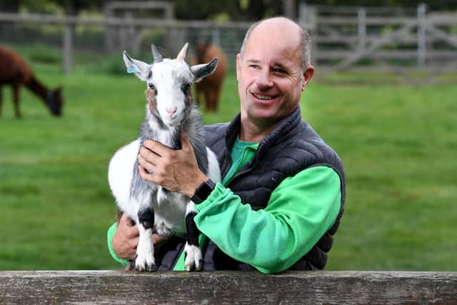 Ian Prentice with a pygmy goat