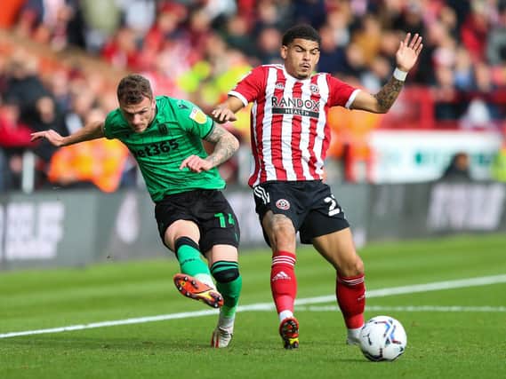 Sheffield United's Morgan Gibbs-White battles for the ball with Stoke's Josh Tymon. Picture: PA.
