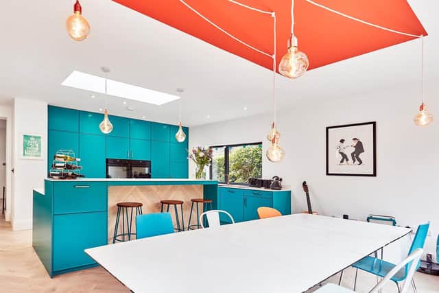 The table was bought years ago from John Lewis and Averil updated it with colourful chairs.