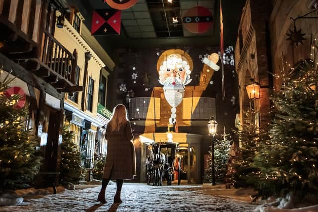 Employee Millie Carroll views 'Christmas at York Castle Museum' in 2020. Picture: Danny Lawson/PA Wire.