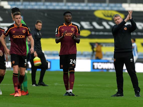 DISAPPOINTMENT: Grant McCann (far right) salutes the travelling Hull City fans at full-time