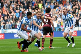 Huddersfield's Tom Lees celebrates opening the scoring. Pictures: Jonathan Gawthorpe