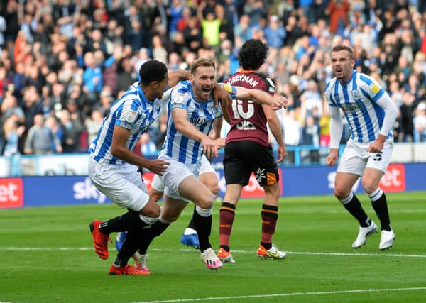 Huddersfield's Tom Lees celebrates opening the scoring. Pictures: Jonathan Gawthorpe