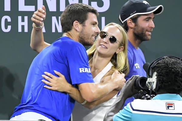 Champion: Cameron Norrie, left, gets a hug from Louise Jacobi after he defeated Nikoloz Basilashvili in the final at the BNP Paribas Open. Picture: AP Photo/John McCoy