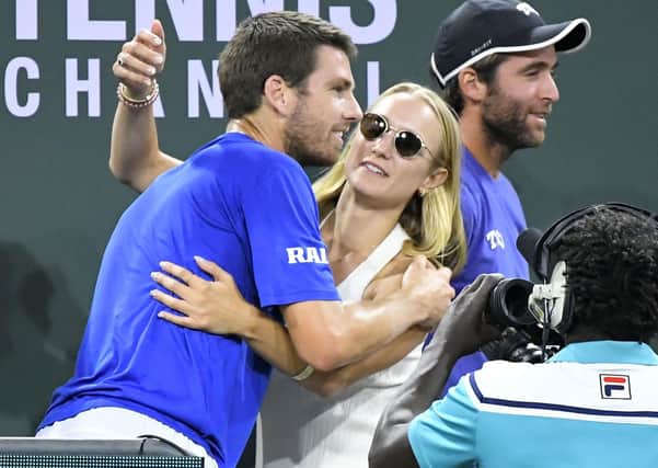 Champion: Cameron Norrie, left, gets a hug from Louise Jacobi after he defeated Nikoloz Basilashvili in the final at the BNP Paribas Open. Picture: AP Photo/John McCoy