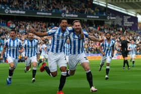 Huddersfield's Tom Lees celebrates opening the scoring against Hull with Levi Colwill.
 (Picture: Jonathan Gawthorpe)