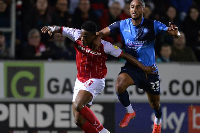 Chiedozie Ogbene can't escape Jordan Obita of  Wycombe Wanderers. 
(Picture: Bruce Rollinson)