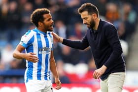 STAND BY YOUR MAN: Huddersfield Town manager Carlos Corberan (right) and midfielder Duane Holmes Picture: Tim Markland/PA