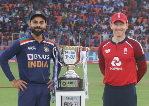 Rivals: India's Virat Kohli and England's Eoin Morgan  with the Series trophy during the 1st T20 International at the Narendra Modi Stadium, Ahmedabad.