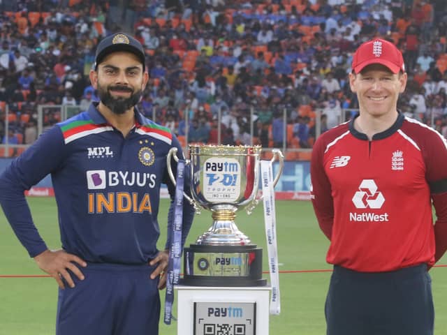 Rivals: India's Virat Kohli and England's Eoin Morgan  with the Series trophy during the 1st T20 International at the Narendra Modi Stadium, Ahmedabad.