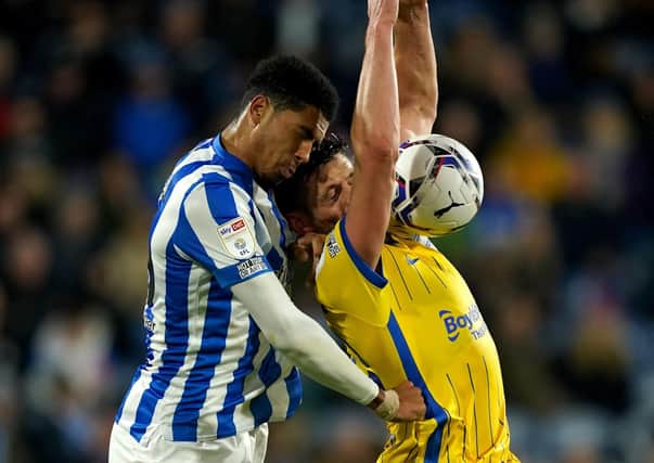 Birmingham City's Lukas Jutkiewicz in action with Huddersfield Town's Levi Colwill. Pictures: PA