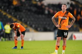 Hull City's George Moncur (right) and Richard Smallwood appears dejected after defeat to Peterborough. Pictures: PA.