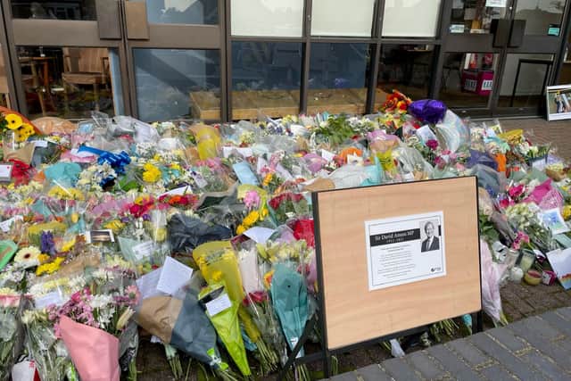A sign placed next to the floral tributes left outside the Belfairs Methodist Church in Leigh-on-Sea, Essex, where Conservative MP Sir David Amess was killed on Friday last week.