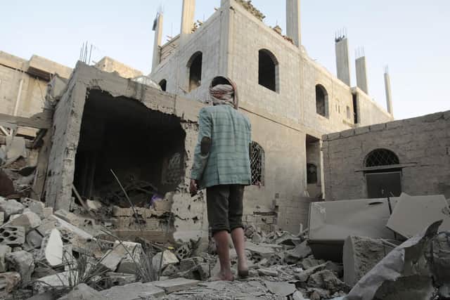 A man stands on the rubble of his house destroyed by Saudi-led airstrikes in Sanaa, Yemen, Friday, Jun. 9, 2017. (AP Photo/Hani Mohammed)