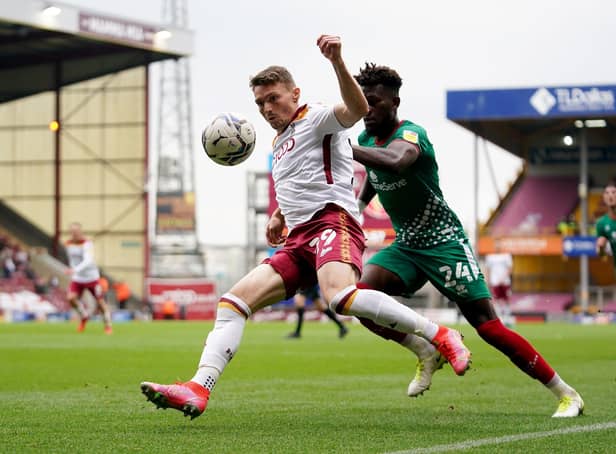 Bradford City's Caolan Lavery (left) and Walsall's Rollin Menayese battle for the ball. Picture: PA