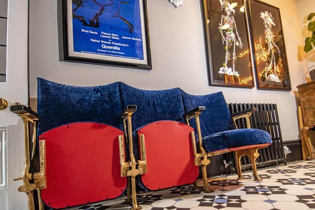 The cinema chairs were an eBay find, reupholstered in blue velvet.