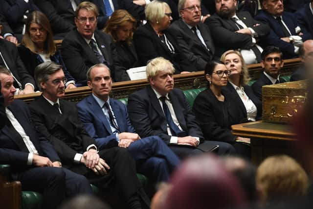 Handout photo issued by UK Parliament of (left to right) Leader of the House of Commons Jacob Rees-Mogg, Lord Chancellor Dominic Raab, Prime Minister Boris Johnson, Home Secretary Priti Patel, Foreign Secretary Liz Truss and Chancellor of the Exchequer, Rishi Sunak in the chamber of the House of Commons, Westminster.