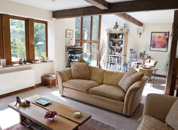 The living room benefits from a feature barn window with mezzanine gallery spanning the full height of the first two floors. A further full width double-glazed window with timber mullions overlooks the garden as well as a feature arched window which overlooks the side of the property.