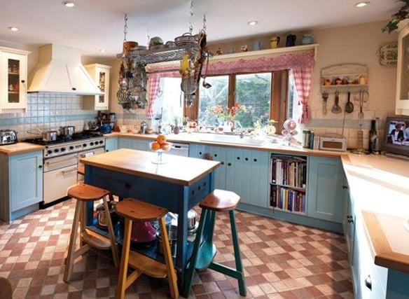 A spacious and lightly decorated room, with a real cottage kitchen feel.