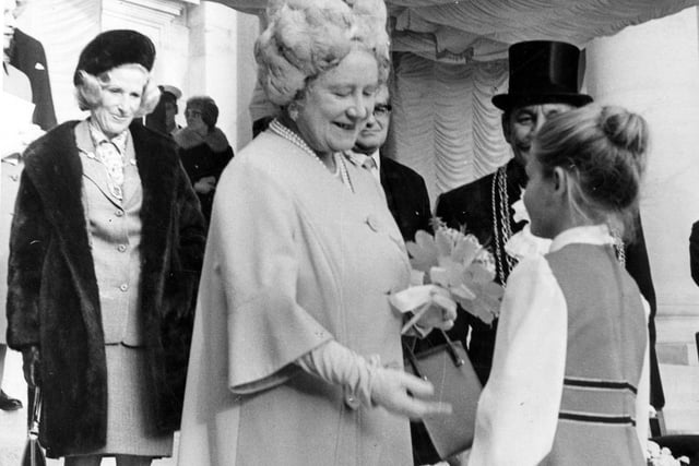The Queen Mother was in Leeds to see the Freedom of the City conferred on H.M.S. Ark Royal in October 1973. Pictured is  Julia King, daughter of crew member, Petty Officer Electrician, Ian King, presenting Her Majesty with a posy of flowers.