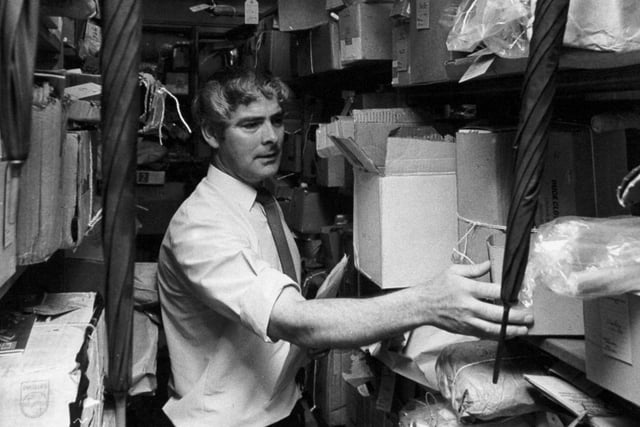 The Aladdin's Cave of the Post Office in July 1973. Pictured is Clarence Bateman among the racks and racks of lost property at Quebec Street.