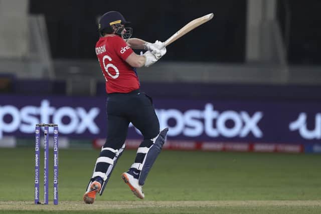 England's captain Eoin Morgan hits 4 runs off the bowling of West Indies' Obed McCoy during the Cricket T20 World Cup match between England and the West Indies at the Dubai International Cricket Stadium (AP Photo/Aijaz Rahi)