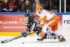 Sheffield Steelers' forward John Armstrong, right, batles with Nottingham Panthers' Matthew Meyers during Saturday night's Challenge Cup clash at the National Ice Centre Picture: EIHL/Karl Denham