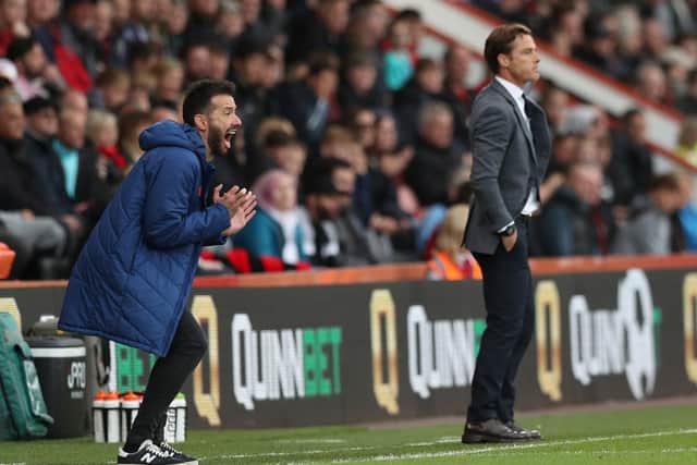 Huddersfield Town manager Carlos Corberan (left) on the touchline. Picture: Kieran Cleeves/PA
