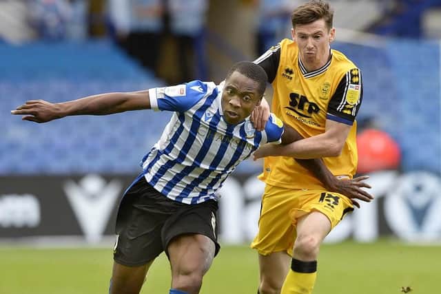 Sheffield Wednesday's Dennis Adeniran tries to braek free from Lincoln City's Conor McGrandles   Picture: Steve Ellis