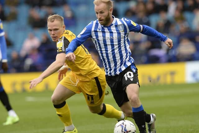 Sheffield Wednesday's Barry Bannan battles with Lincoln City's Lewis Fiorini   Picture: Steve Ellis