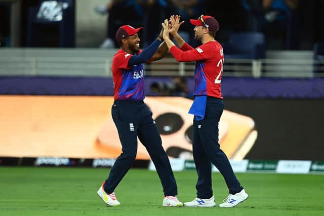 CAUGHT HIM: Dawid Malan of England celebrates with team mate Chris Jordan after taking a catch to dismiss Chris Gayle of West Indies. Picture: Getty Images
