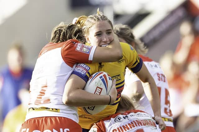 Leeds's Caitlin Beevers is tackled by St Helens's Emily Rudge & Jodie Cunningham during the Women's Super League Grand Final at Headingley Picture by Allan McKenzie/SWpix.com
