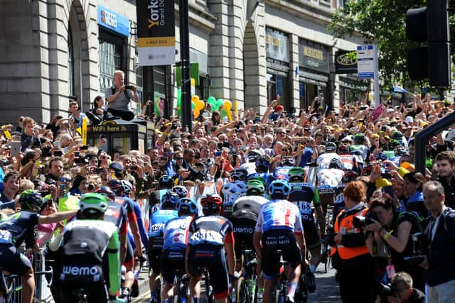 Crowds line the Headrow at the start at the first stage of the Tour de France in in Leeds in 2014 (Picture: Bruce Rollinson)