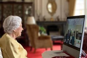 Queen Elizabeth II at Windsor Castle, Berkshire, holding a virtual audience via video link