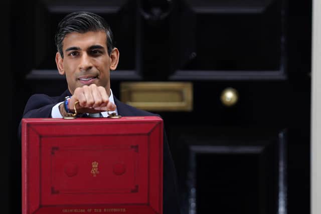 Chancellor Rishi Sunak outside 11 Downing Street before delivering his Budget.