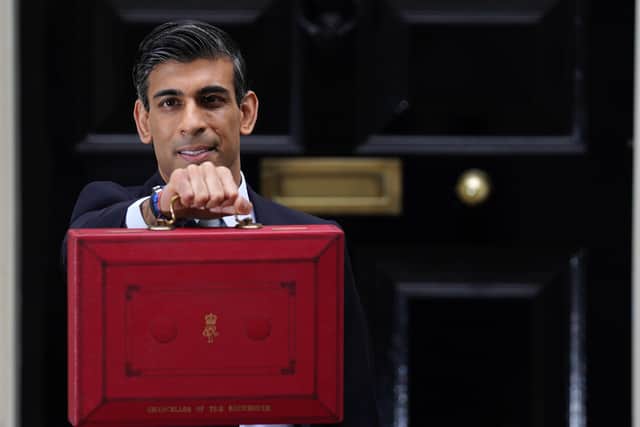 Chancellor Rishi Sunak outside 11 Downing Street before delivering his Budget.