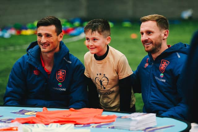 Matty Pearson and Tom Lees signing autographs at the Utilita Football Festival hosted by Huddersfield Town Foundation (Picture: Huddersfield Town)