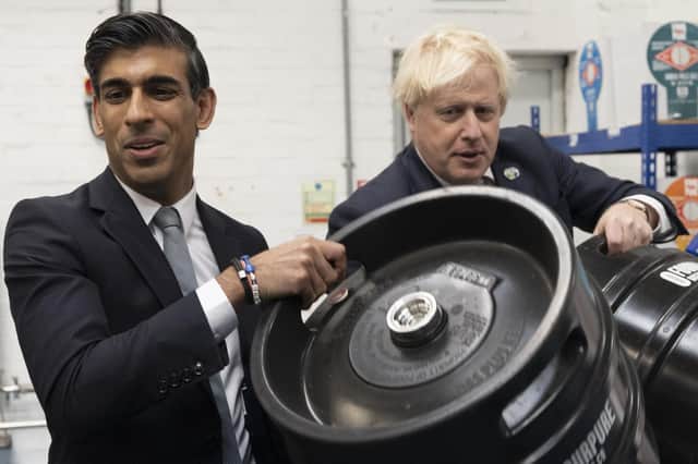 Prime Minister Boris Johnson (right) with Chancellor of the Exchequer Rishi Sunak during a visit to Fourpure Brewery in Bermondsey, London, after Sunak delivered his Budget to the House of Commons. (PA)