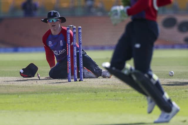 England's captain Eoin Morgan attempts a run out during the Cricket Twenty20 World Cup match between England and Bangladesh. (AP Photo/Aijaz Rahi)