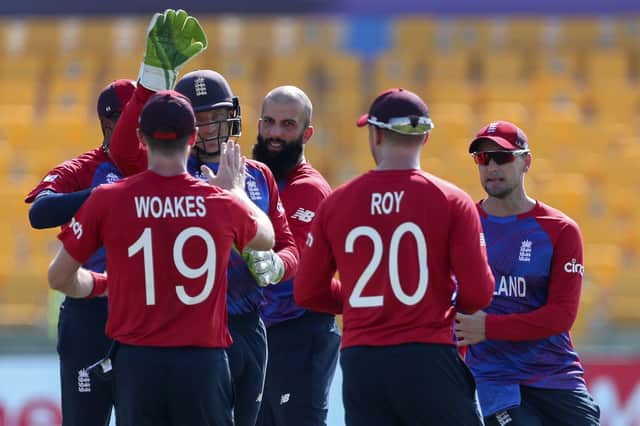 Easy does it: England players, including Jason Roy, front right, celebrate the dismissal of Bangladesh’s Mohammad Naim at the T20 Cricket World Cup yesterday. (Picture: AP)