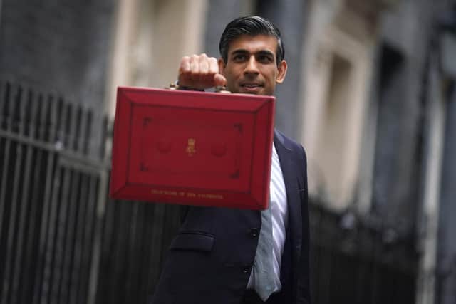 Chancellor of the Exchequer Rishi Sunak holds his ministerial 'Red Box' outside 11 Downing Street.