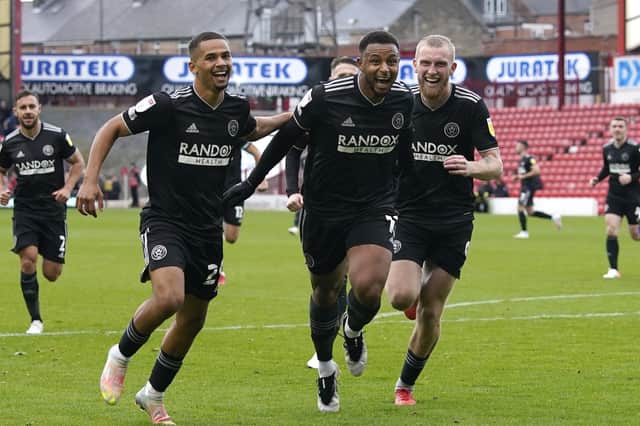 Sheffield United's Lys Mousset celebrates after scoring the first goal with lliman Ndiaye and Oli McBurnie at Oakwell in their 3-2 win over Barnsley. Picture: Andrew Yates/Sportimage