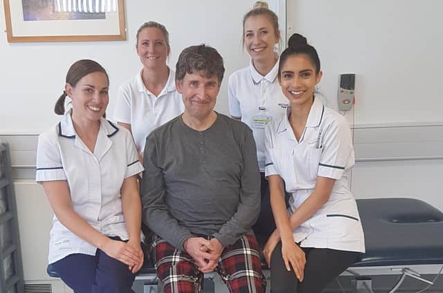 Robert Minton-Taylor with some of the care team who saved his life.