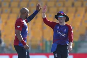 Bring on Australia: England's captain Eoin Morgan, right, congratulating bowler Tymal Mills after taking the wicket of Bangladesh's Mahedi Hasan. Picture: AP