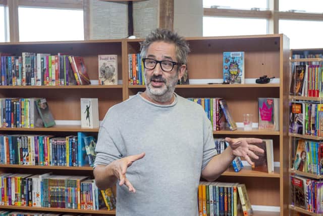 The author and comedian seen here opening a school library in Sheffield in 2019. (Scott Merrylees).
